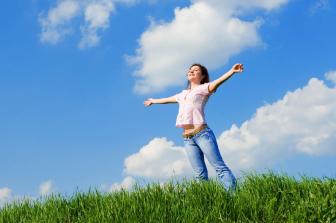 happy young woman dreams to fly on winds