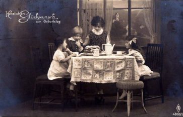 girls_with_birthday_cake-_postcard_from_1920-640x411