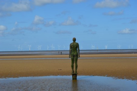 iron-man-crosby-beach-antony-gormley-rear-wind-turbines